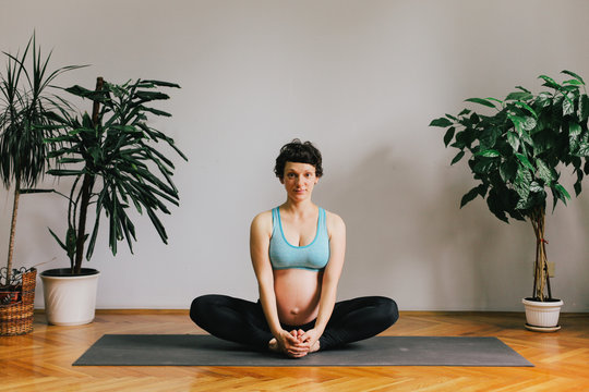 Pregnant woman practicing yoga