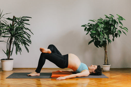 Pregnant woman practicing yoga