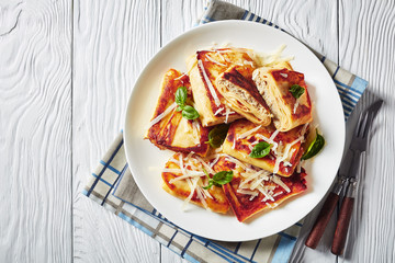 Meat and mushrooms Stuffed Crepes on a plate