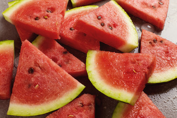 Sliced pieces of watermelon, chilled with ice, refreshing summer berry.