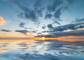 Fototapeta premium dramatic sunset during the rain with blue sky