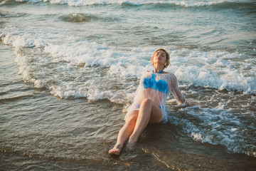 Plus size woman in holidays, Picturesque view of the beach. Vacations and adventure concept  