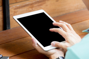 man using tablet computer with blank screen