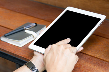 man using tablet computer with blank screen