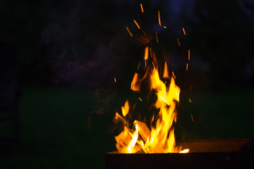 the bonfire burns beautifully on a warm summer evening