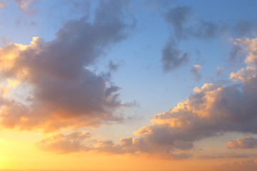 Naklejka na ściany i meble background of sunset sky with clouds