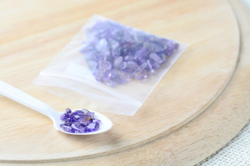 Colorful beads on a wooden surface. Various of shapes and colors to make jewelry
