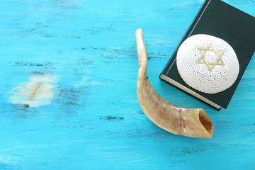 Fototapeta na wymiar religion image of Prayer book and Shofar (horn) jewish religious symbols. Rosh hashanah (jewish New Year holiday), Shabbat and Yom kippur concept.