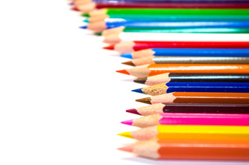 Many color pencils isolated on white background with copy space for text.Close up.