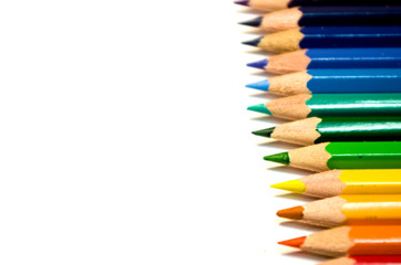 Many color pencils isolated on white background with copy space for text.Close up.
