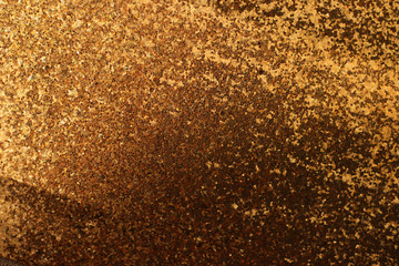 background of abstract glitter lights. gold and black. de focused