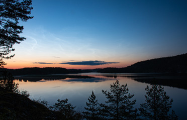 Fototapeta na wymiar summer evening in koreliya sunset river north water panorama view