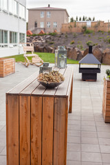 Outdoor restaurant terrace with wooden furniture