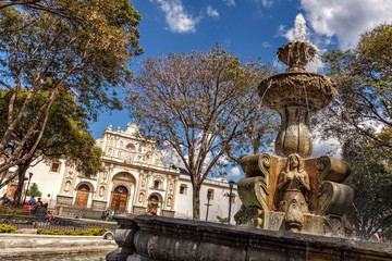 Fototapeta na wymiar Main Square with Fountain and Cathedral de San José, Antigua Guatemala