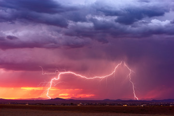 Lightning storm at sunset
