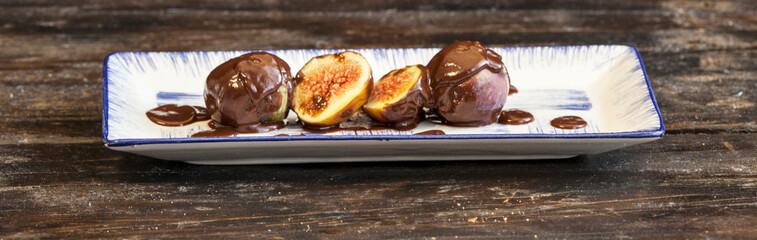 Close-up of a fig dipped in hot chocolate