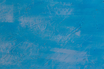 Background in the form of a wooden surface, first putty, and then painted blue with light spots