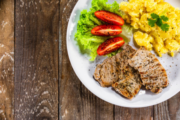Grilled pork chops with mashed potatoes and vegetables