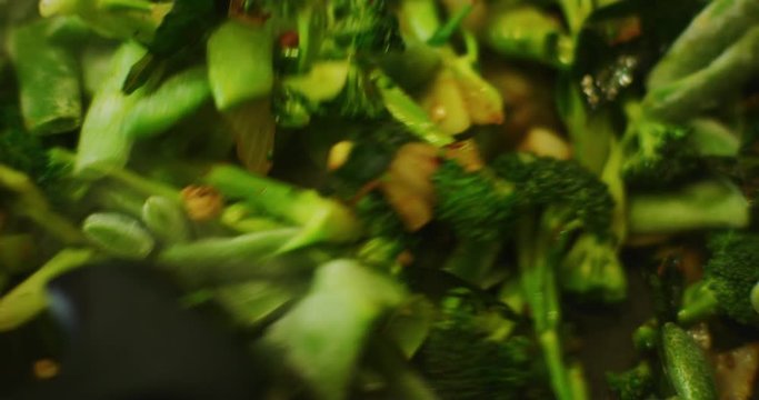 Slow motion shot of cooking a simple and easy vegetarian curry.
