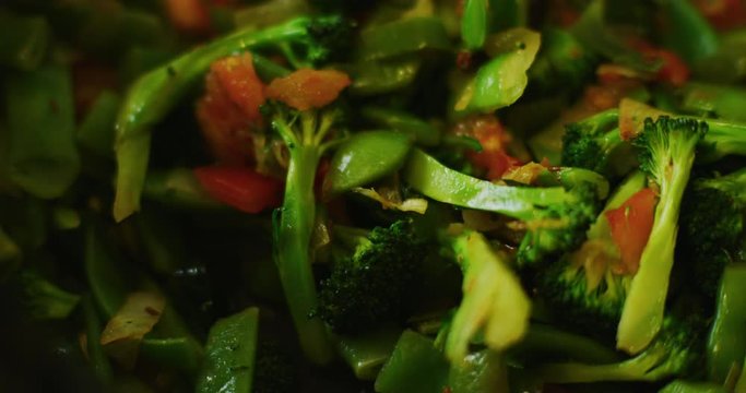 Slow motion shot of cooking a simple and easy vegetarian curry.