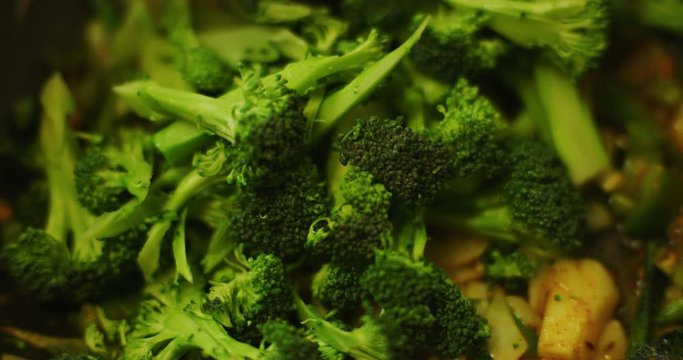 Slow motion shot of cooking a simple and easy vegetarian curry.