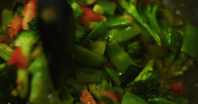 Slow motion shot of cooking a simple and easy vegetarian curry.