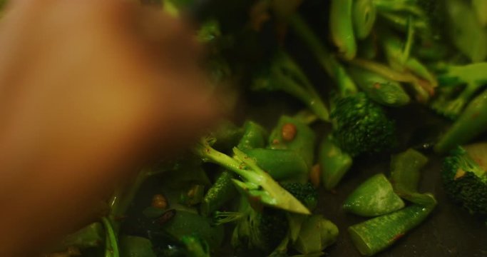 Slow motion shot of cooking a simple and easy vegetarian curry.