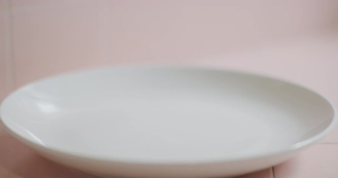 Slow motion shot of cooking and plating a simple and easy vegetarian curry.