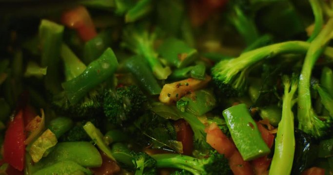 Slow motion shot of cooking a simple and easy vegetarian curry.