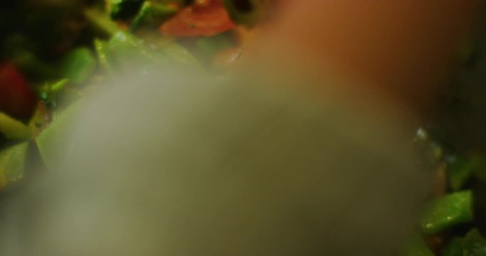 Slow motion shot of cooking a simple and easy vegetarian curry.