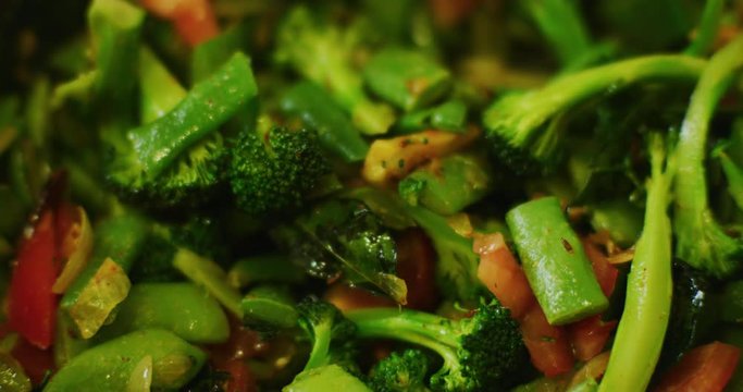 Slow motion shot of cooking a simple and easy vegetarian curry.