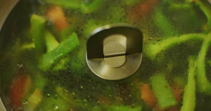 Slow motion shot of cooking a simple and easy vegetarian curry.
