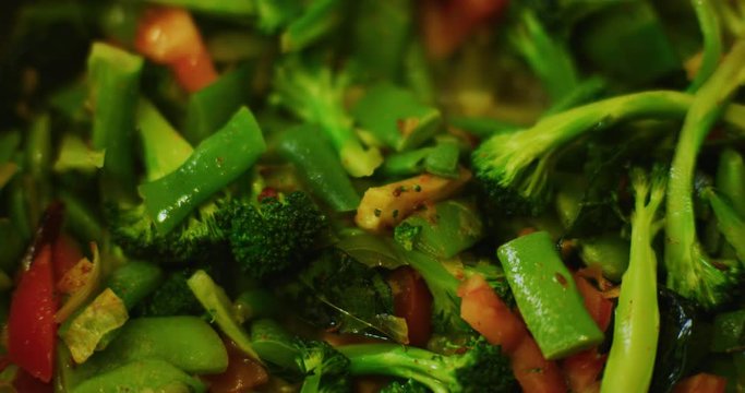 Slow motion shot of cooking a simple and easy vegetarian curry.