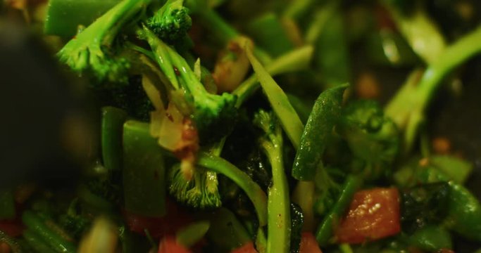 Slow motion shot of cooking a simple and easy vegetarian curry.