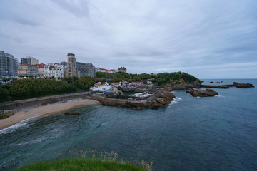 Obraz premium View from the observation deck on the coast of the Atlantic Ocean in Biarritz. French Basque Country on a summer evening. Concepts of tourism, leisure and beauty.