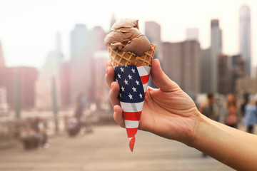 American ice cream in hands on the city