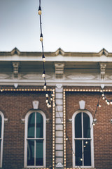 Beautiful historic building with old large windows, outdoor lights in a historic place of Denver city.
