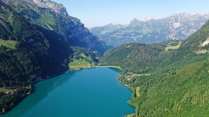 Fototapeta na wymiar Klöntalersee lake in mountains. Kanton Glarus, Switzerland. Aerial view.