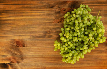 Bunch of Green Grapes on Brown Wooden Rustic Background