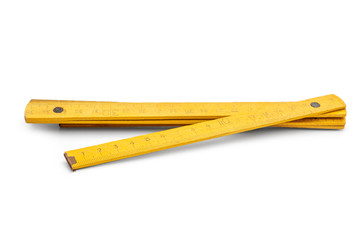 Wooden folding meter on white background.