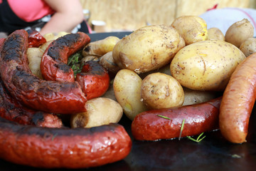 Cooking sausages and potatoes