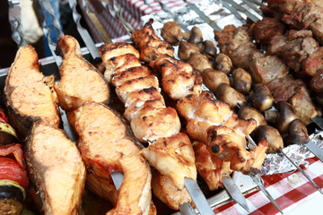 Meat and fish kebabs on skewers
