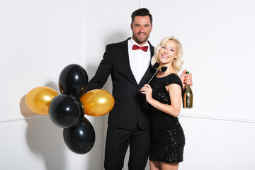 Happy young couple is celebrating.