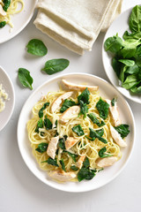 Spaghetti with spinach leaves, grilled chicken breast and cheese