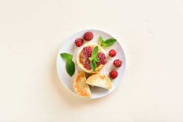 Cottage cheese pancakes with fresh raspberries