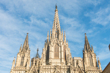 Fototapeta na wymiar Facade of the Metropolitan Cathedral Basilica of Barcelona (also known as The Cathedral of the Holy Cross and Saint Eulalia) located in the gothic quarter in Catalonia, Spain, Europe.