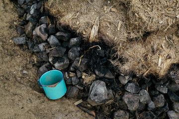 From above hot charcoal stack covered with dried plant fibers