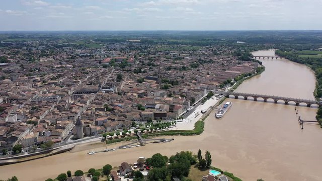 Panoramic aerial view of Libourne city on Dordogne river on sunny summer day, Gironde, France