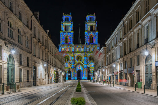 Joanna of Arc street that flows into the Church of the Holy Cross in Orleans, France. Illuminated with the technique called maping