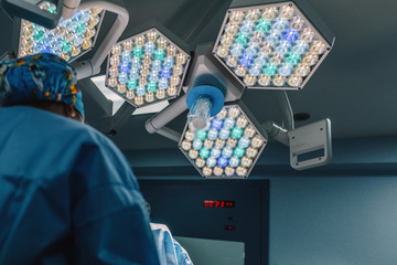 From below high power surgical lamps in operating room of hospital